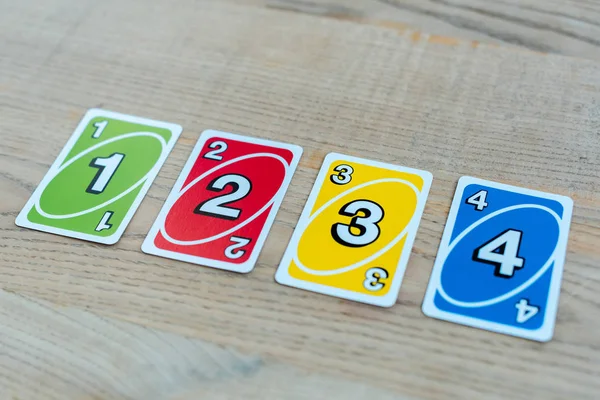 KYIV, UKRAINE - NOVEMBER 22, 2019: colorful uno playing cards on table — Stock Photo