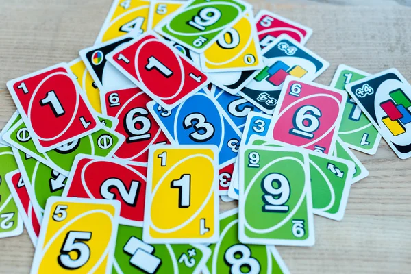 KYIV, UKRAINE - NOVEMBER 22, 2019: top view of colorful uno playing cards on table — Stock Photo