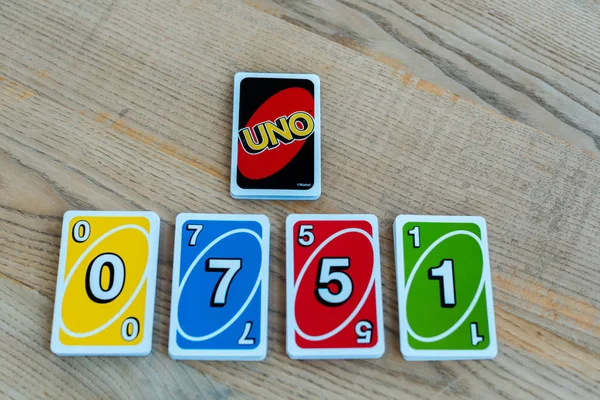 KYIV, UKRAINE - NOVEMBER 22, 2019: top view of playing card with uno letters on desk — Stock Photo