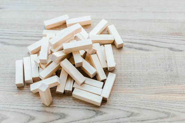 KYIV, UKRAINE - NOVEMBER 22, 2019: pile with small blocks of wood tower game on desk — Stock Photo