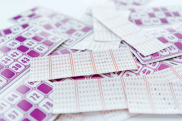 Selective focus of purple lottery paper tickets — Stock Photo