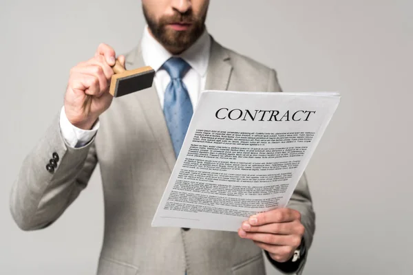 Cropped view of lawyer putting stamp on contract isolated on grey — Stock Photo