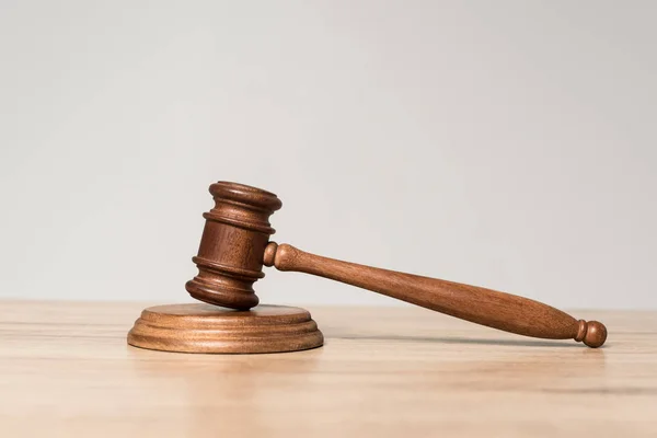 Gavel on wooden desk isolated on grey with copy space — Stock Photo