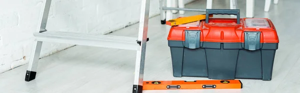 Panoramic shot of toolbox near ladder — Stock Photo