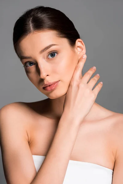 Attractive naked woman with perfect skin, isolated on grey — Stock Photo