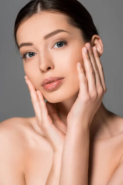 Portrait of tender young woman with perfect skin, isolated on grey — Stock Photo