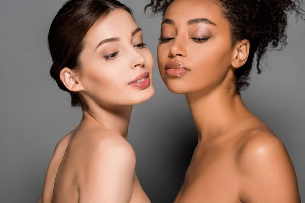 Portrait of beautiful tender multiracial girls, on grey — Stock Photo