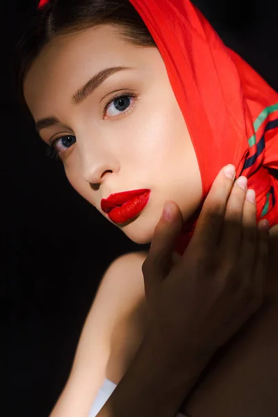 Portrait of elegant beautiful girl with red scarf, isolated on black — Stock Photo