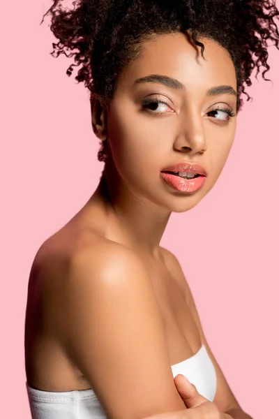 Portrait of attractive african american girl with clean face, isolated on pink — Stock Photo