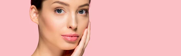 Panoramic shot of attractive young woman with perfect skin, isolated on pink — Stock Photo