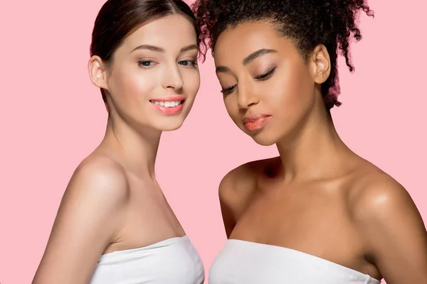 Portrait of multiethnic girls with clean skin, isolated on pink — Stock Photo
