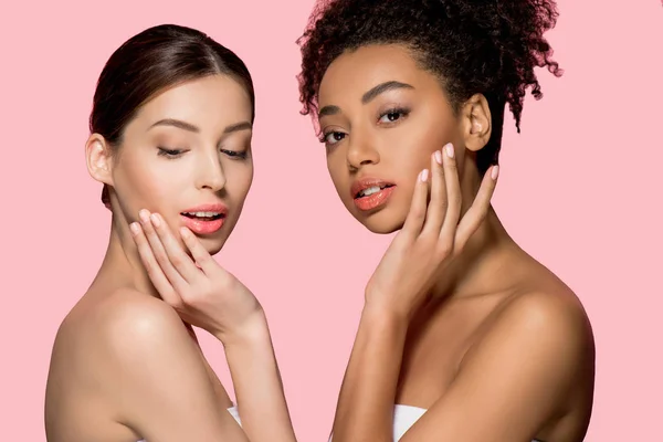 Portrait of tender multicultural girls with clean skin, isolated on pink — Stock Photo