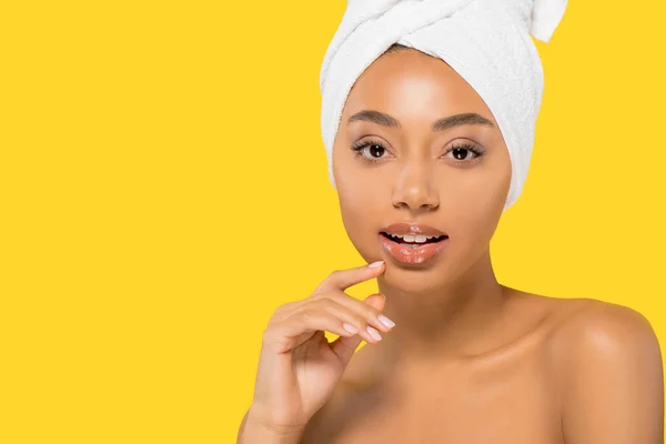 Menina afro-americana com toalha na cabeça, isolado em amarelo — Stock Photo