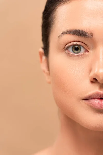 Cropped view of girl with clean face looking at camera isolated on beige — Stock Photo