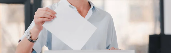 Panoramic shot of voter holding blank ballot — Stock Photo