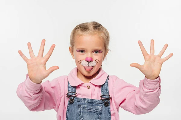 Cheerful child with cat muzzle painting on face showing palms while looking at camera isolated on white — Stock Photo