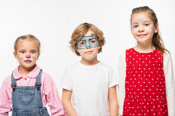 Happy friends with colorful face paintings smiling at camera isolated on white — Stock Photo