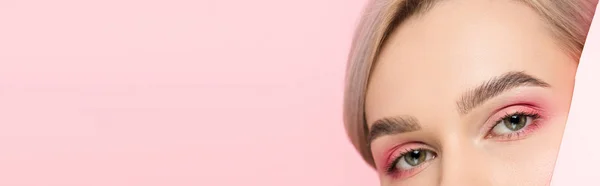 Panoramic shot of girl with pink makeup and piece of paper, isolated on pink — Stock Photo