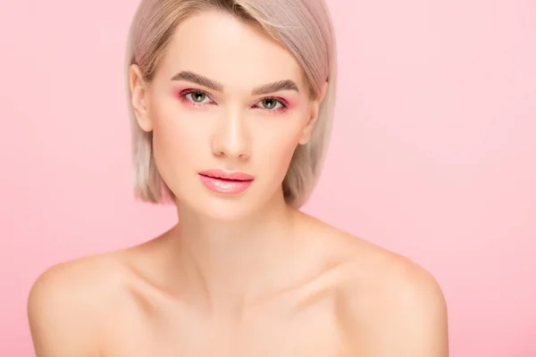 Attractive nude girl with perfect skin and pink makeup, isolated on pink — Stock Photo