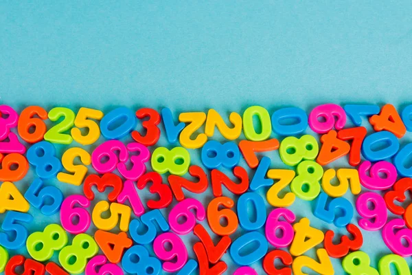 Top view of colorful numbers on blue background — Stock Photo