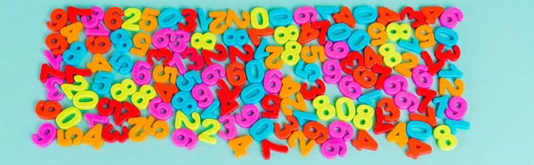 Top view of colorful numbers on blue background, panoramic shot — Stock Photo