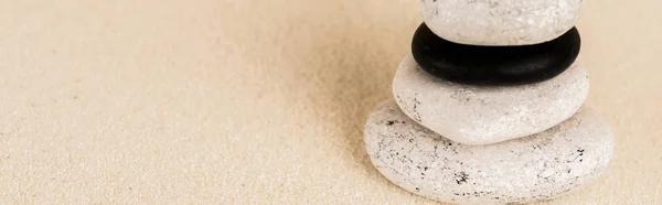 Panoramic shot of zen stones on sand surface with copy space — Stock Photo