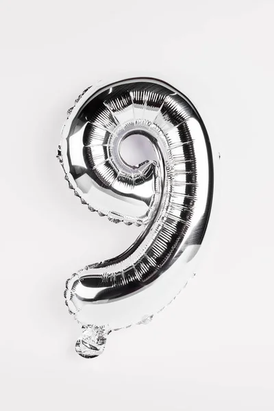 Silver balloon in shape of nine number on grey background — Stock Photo