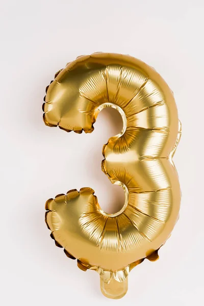 Festive balloon in shape of three number on grey background — Stock Photo