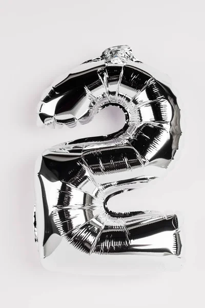 Decorative balloon in shape of two number on grey background — Stock Photo