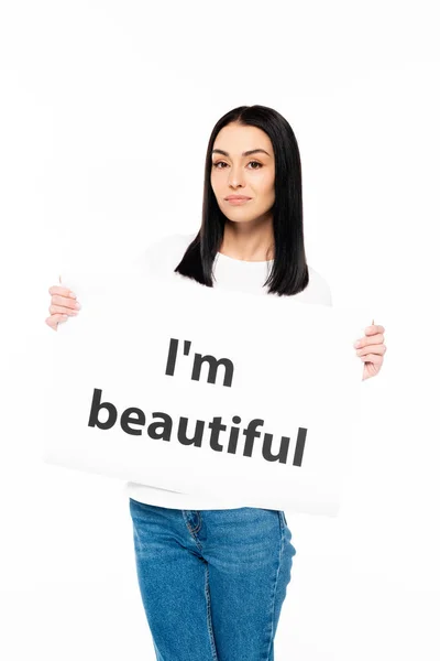 Attractive woman holding poster with i`m beautiful lettering isolated on white — Stock Photo