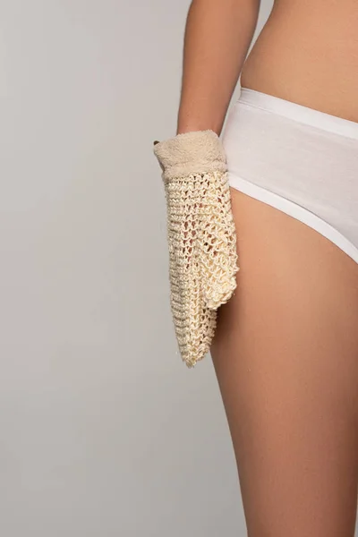 Cropped view of woman with perfect skin holding exfoliation glove, isolated on grey — Stock Photo