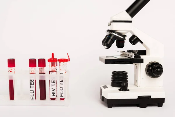 Microscope and samples with lettering on white — Stock Photo