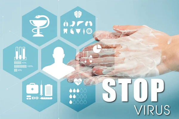 Cropped view of man washing hands near stop virus lettering on blue — Stock Photo