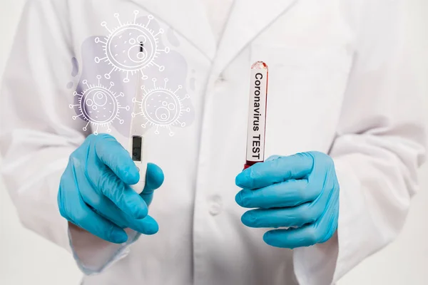 Cropped view of scientist holding sample with coronavirus test lettering and digital thermometer near illustration of coronavirus on white — Stock Photo