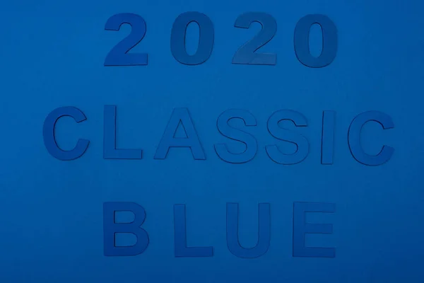 Top view of classic blue lettering and 2020 numbers isolated on blue — Stock Photo