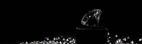 Panoramic shot of diamond near gemstones isolated on black — Stock Photo