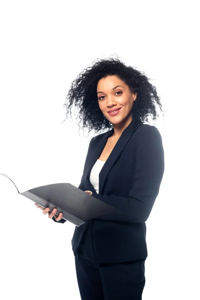 African american businesswoman with folder smiling and looking at camera isolated on white — Stock Photo