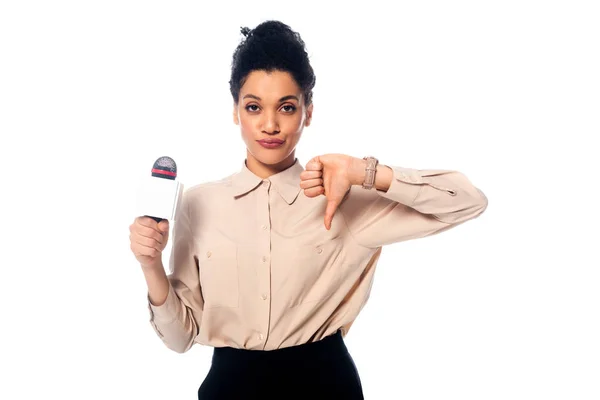 Front view of african american journalist with microphone showing dislike with thumb down isolated on white — Stock Photo