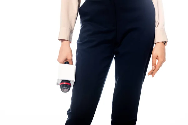 Cropped view of african american journalist in black pants with microphone isolated on white — Stock Photo