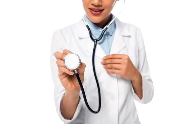 Cropped view of african american doctor showing stethoscope isolated on white — Stock Photo