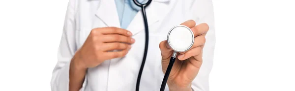 Cropped view of african american doctor showing stethoscope isolated on white, panoramic shot — Stock Photo