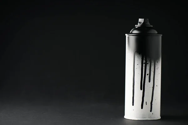 Graffiti paint can on black with copy space — Stock Photo