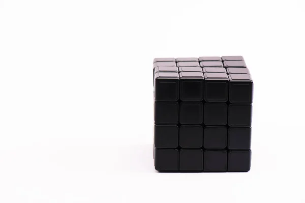 KYIV, UKRAINE - FEBRUARY 21, 2020: black rubik cube isolated on white with copy space — Stock Photo