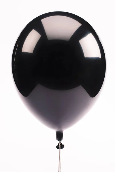 Black and shiny balloon isolated on white — Stock Photo