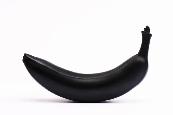 Schwarze und nahrhafte Banane auf weiß mit Kopierraum — Stockfoto