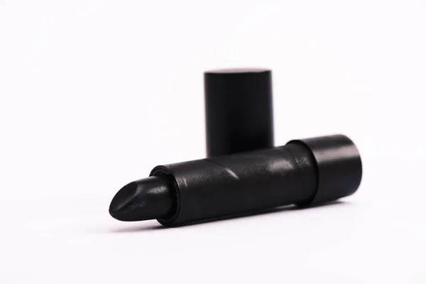 Selective focus of black lipstick on white with copy space — Stock Photo