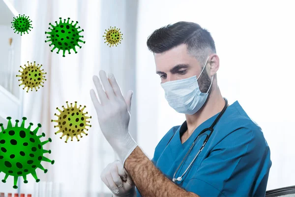 Young doctor in medical mask putting on protective latex gloves, bacteria illustration — Stock Photo