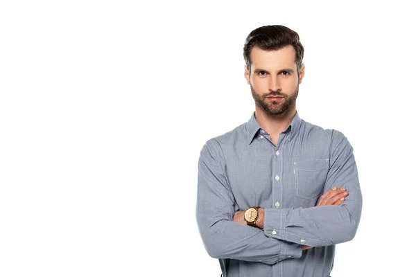 Handsome man standing with crossed arms isolated on white — Stock Photo