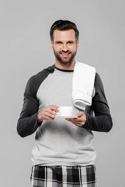 Cheerful bearded man holding cup of coffee isolated on grey — Stock Photo