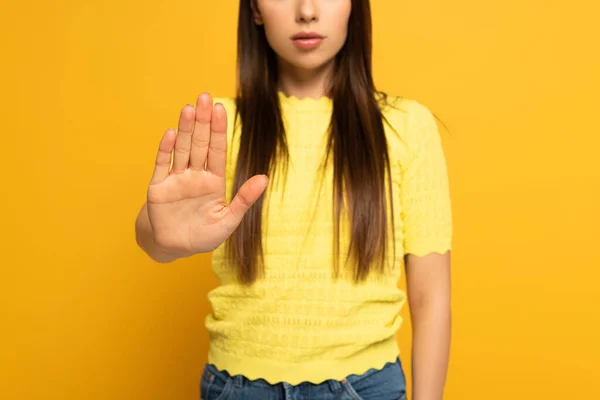 Cropped view of woman showing no sign on yellow background — Stock Photo